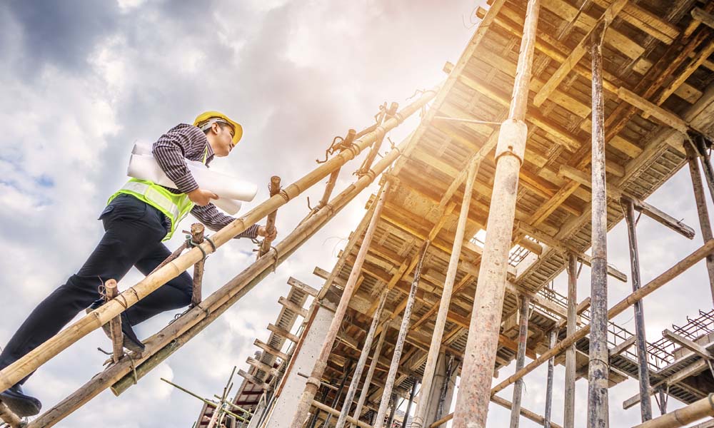 Construction Safety Matters - Ladder Safety at the Construction Site - Construction Worker Climbing up a Tall Ladder towards Scaffolding